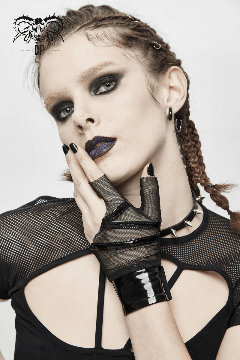 Stylish model showcasing black mesh fingerless gloves, adding punk flair to her edgy look.