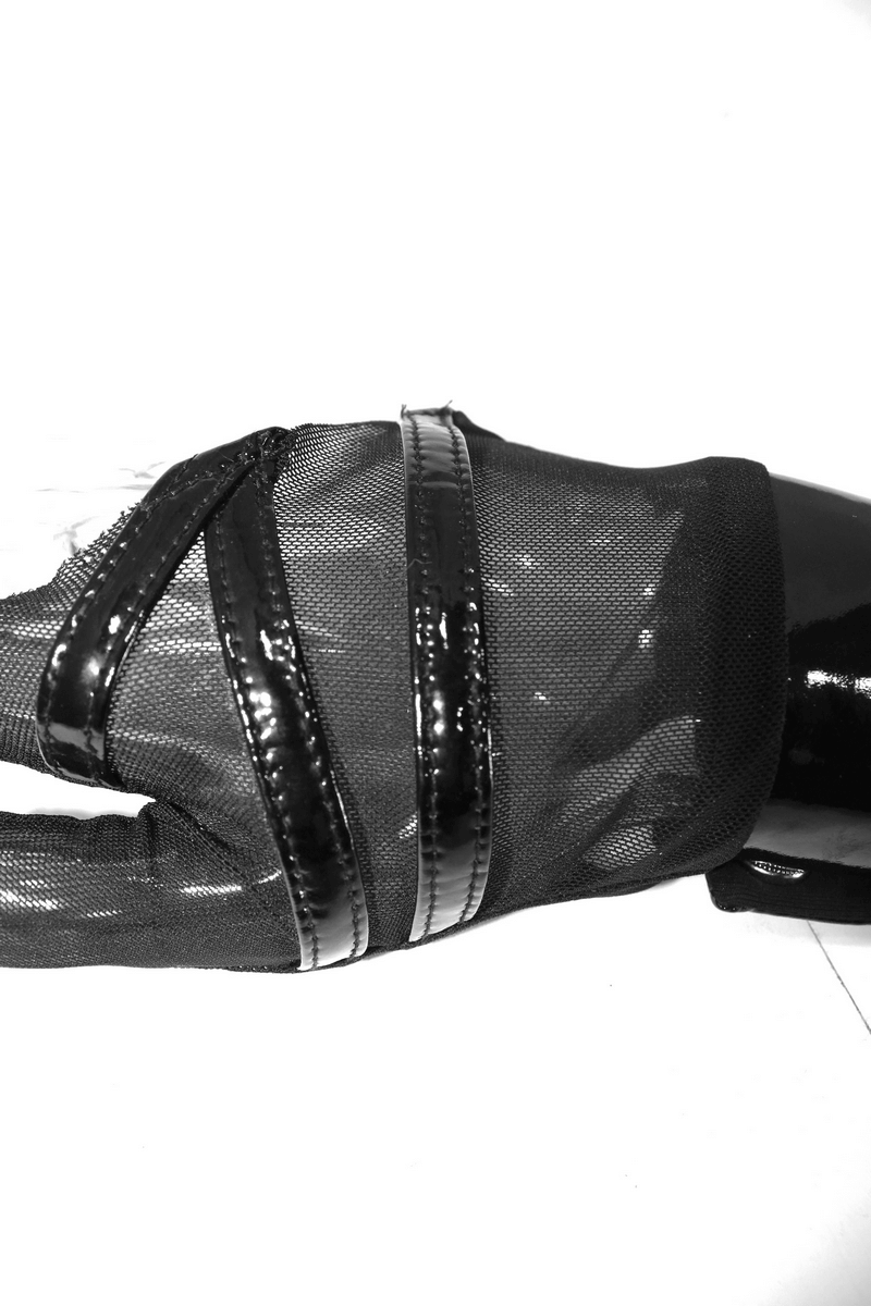 Black mesh fingerless gloves with snap fastenings, a stylish punk accessory for women's fashion.