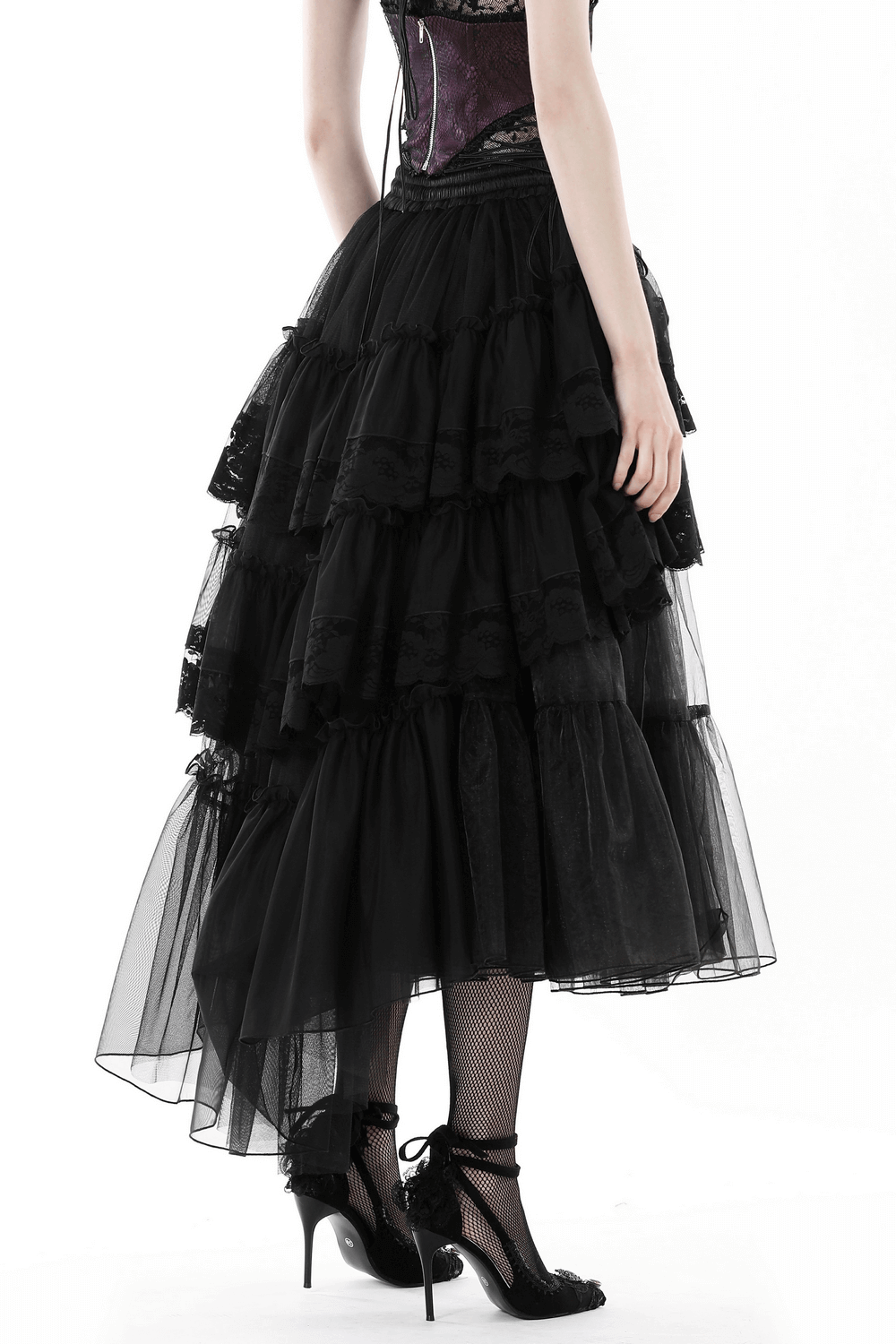 Black mesh gothic skirt with lace, ruffles, and an asymmetrical hem, perfect for edgy outfits and dramatic flair.