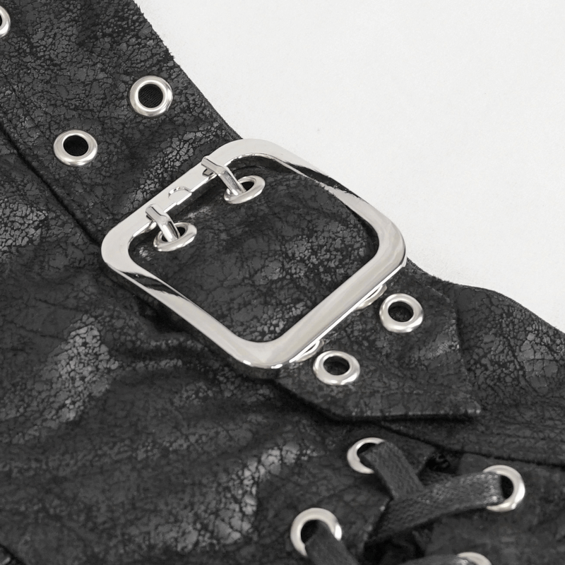 Close-up of silver buckle detail on women's black mesh skirt with eyelets and lacing for a stylish, edgy look.