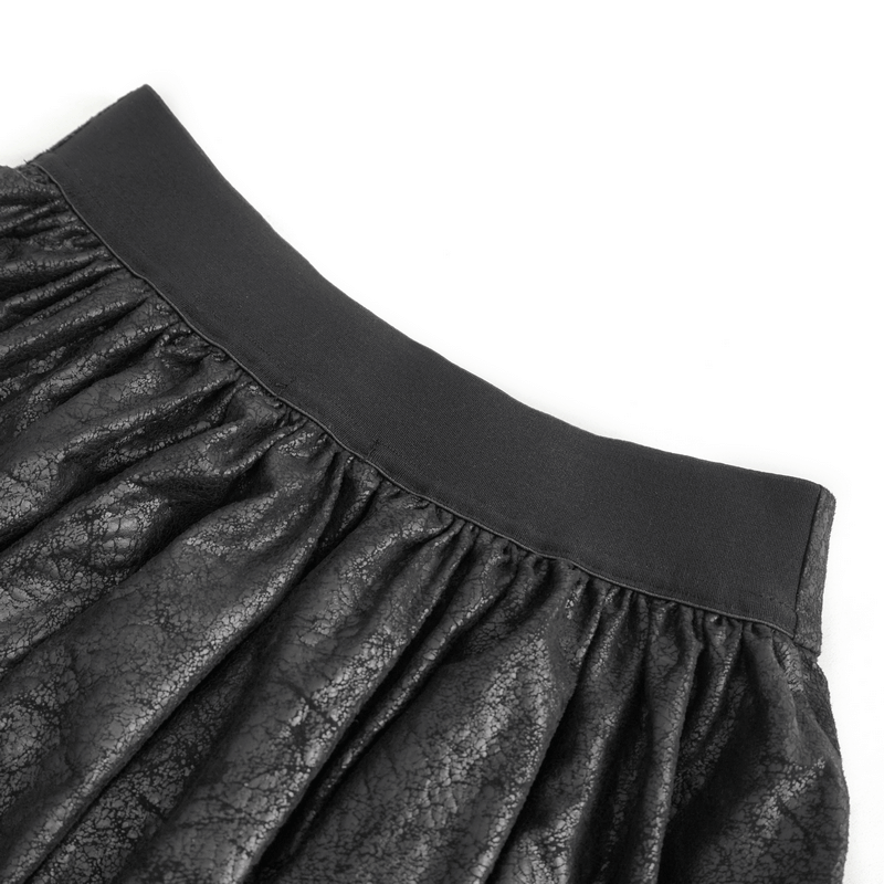 Close-up of the waistband of a women's black mesh splice irregular skirt showcasing its stylish texture.