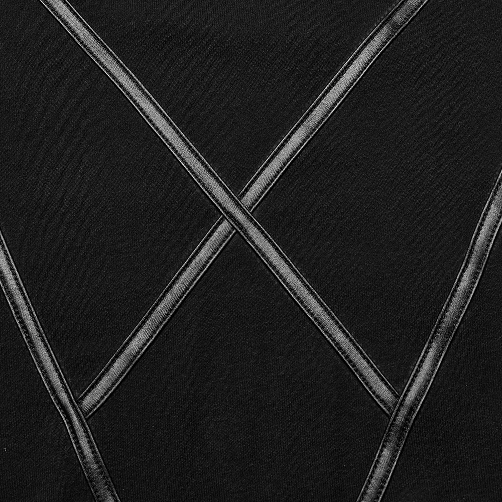 Close-up of faux leather strips on a black knit fabric, showcasing a stylish Gothic design for the Moon Print Top.