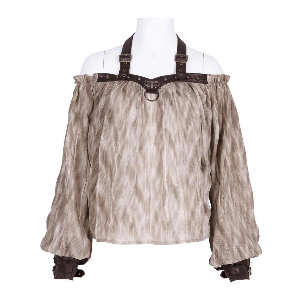 Women's off-shoulder coffee top with buckle harness and leather cuffs, showcasing a bold and edgy style.