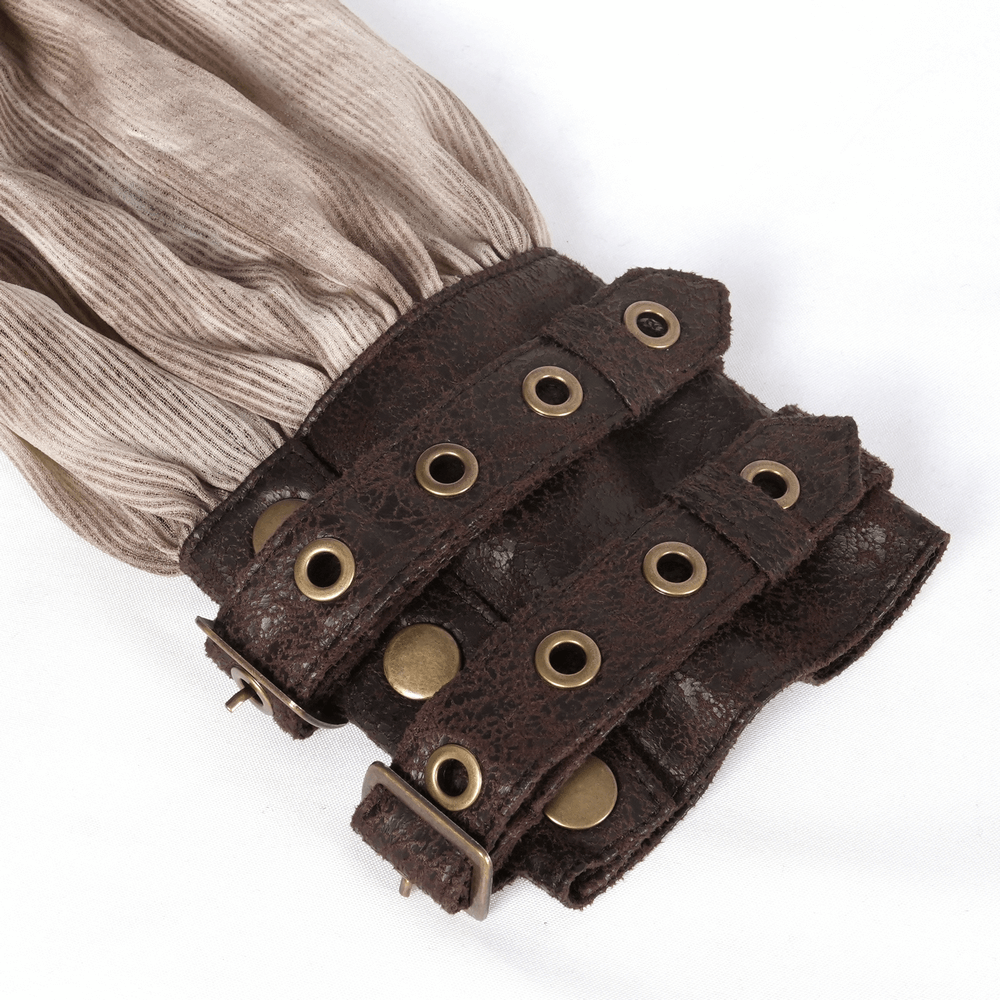 Close-up of adjustable faux leather cuffs with buckle details on an edgy off-shoulder coffee top for women.