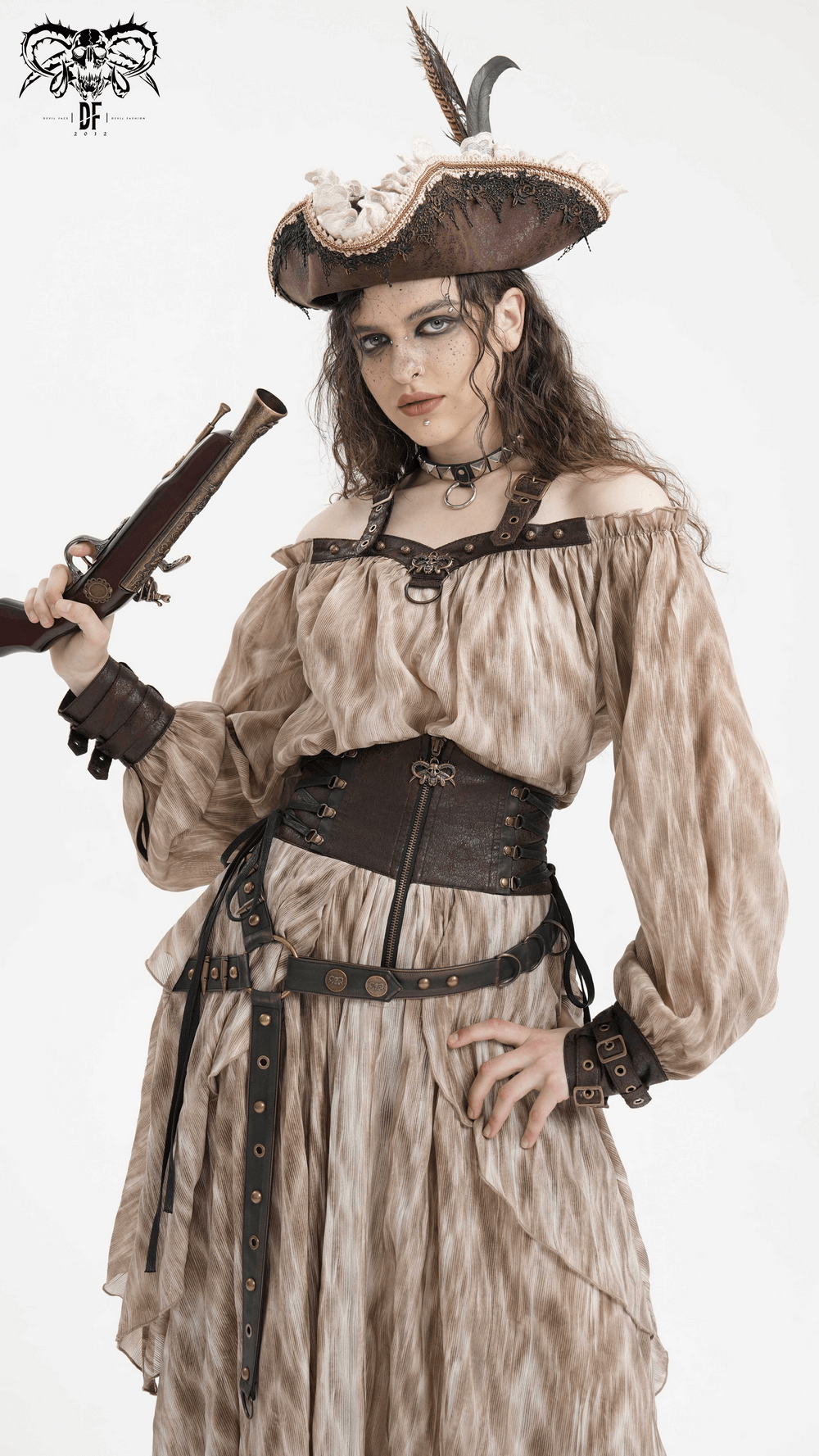 Edgy woman in off-shoulder coffee top, pirate hat, and leather cuffs, holding a rifle with confident flair.