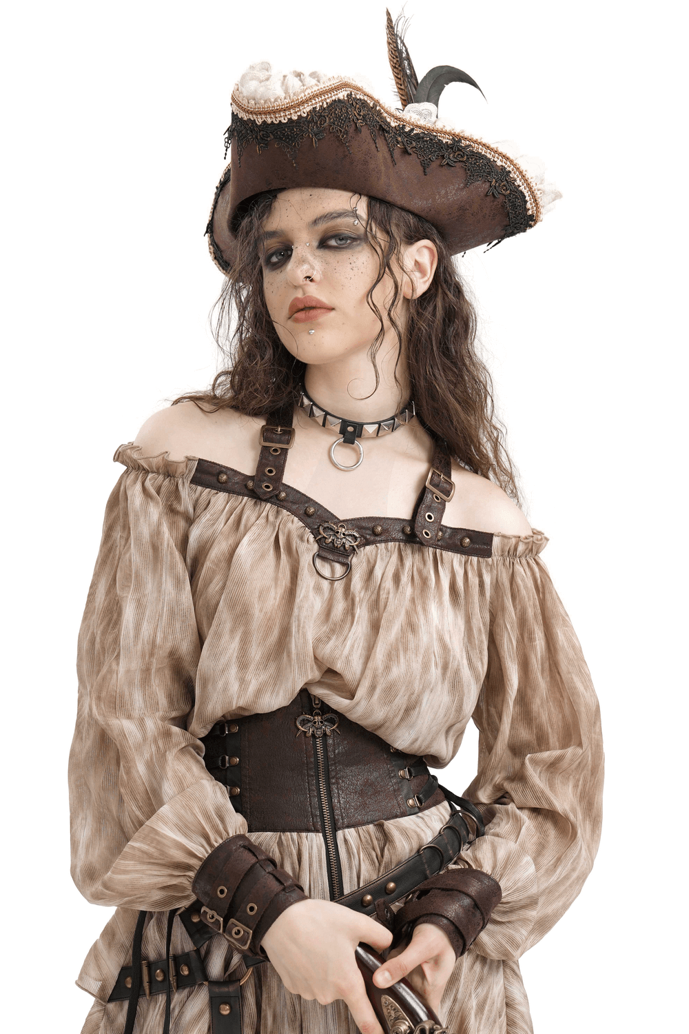 Edgy woman wearing an off-shoulder coffee top with buckle harness, pirate hat, and leather accents, showcasing bold style.