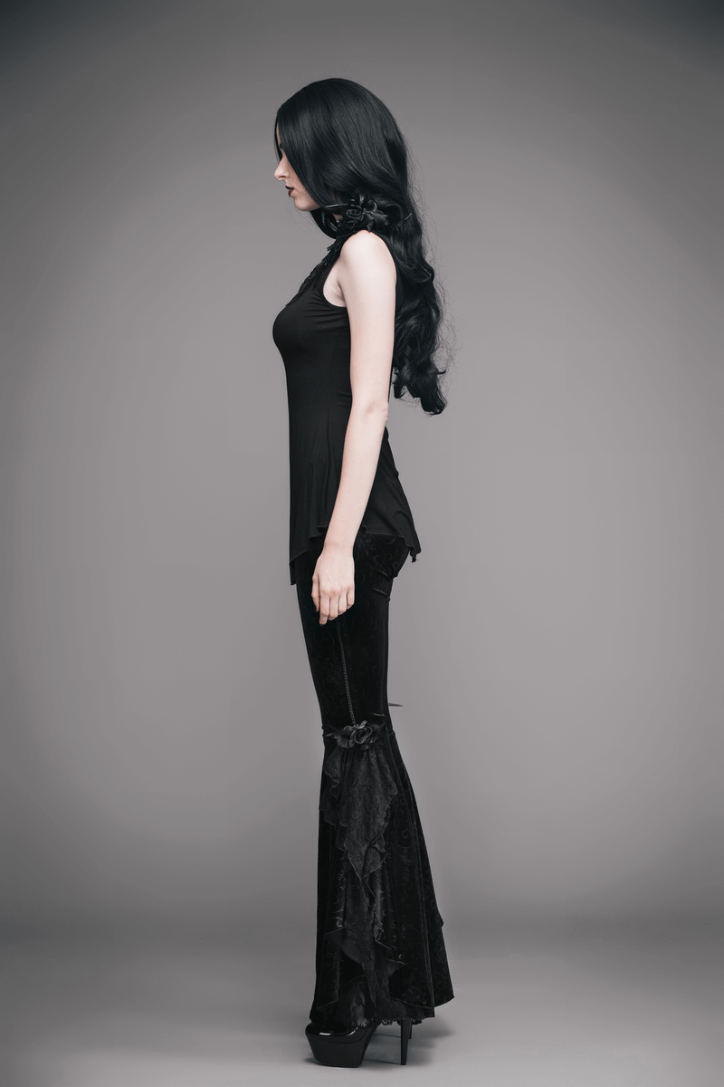 Model showcasing a black women's one sleeve asymmetric gothic top paired with stylish flared pants.