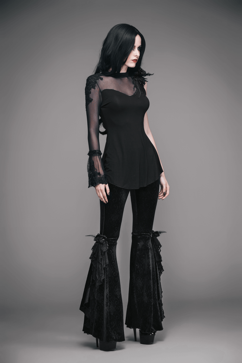 Stylish woman in a black gothic one sleeve asymmetric top with flared pants, showcasing elegant gothic fashion.
