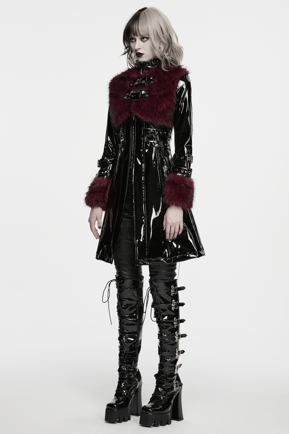 Women's Patent Leather Coat with Burgundy Faux Fur, featuring stunning bondage straps and dramatic silhouette.