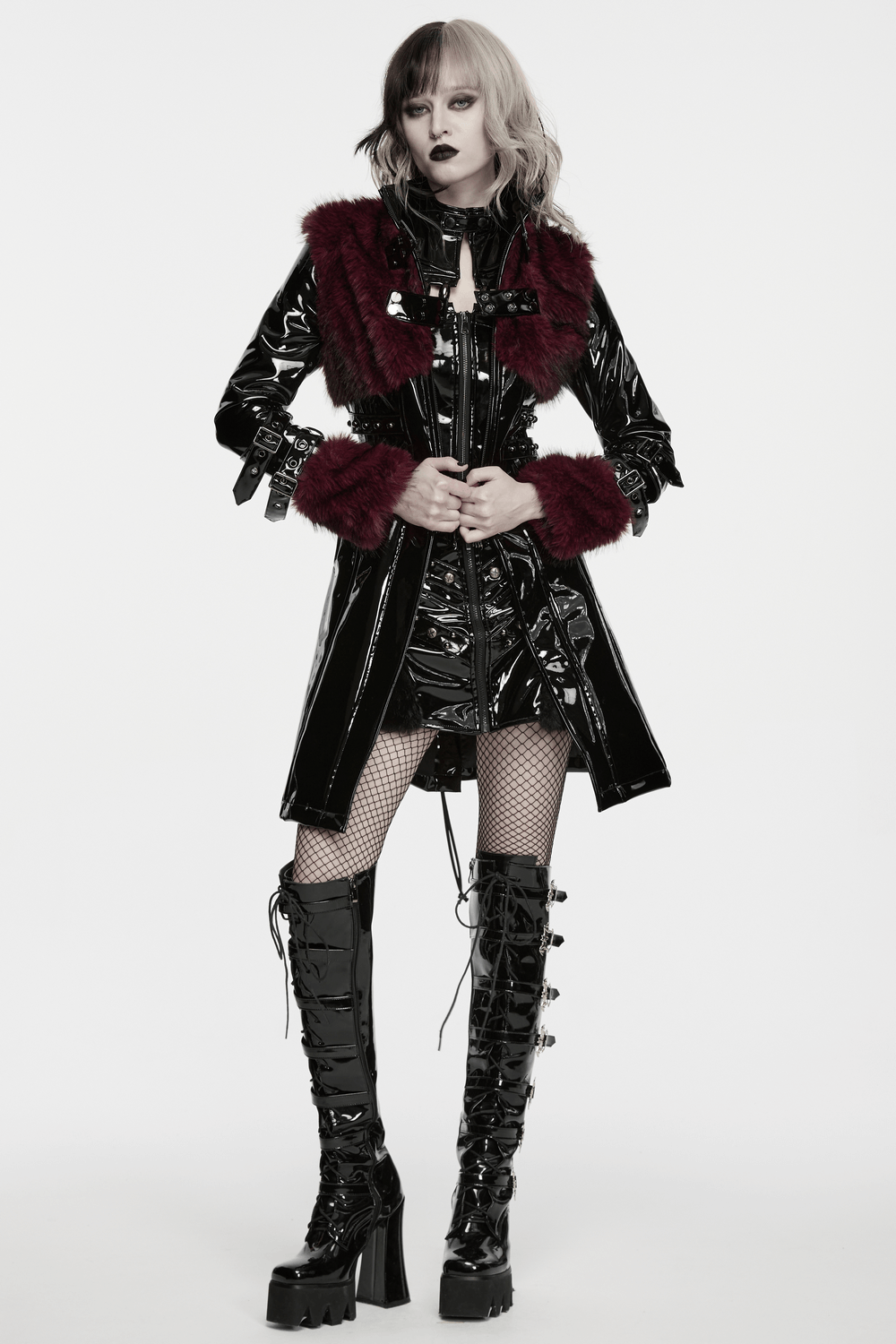 Women's Patent Leather Coat with Burgundy Faux Fur on trendy model showcasing gothic style and bold details.
