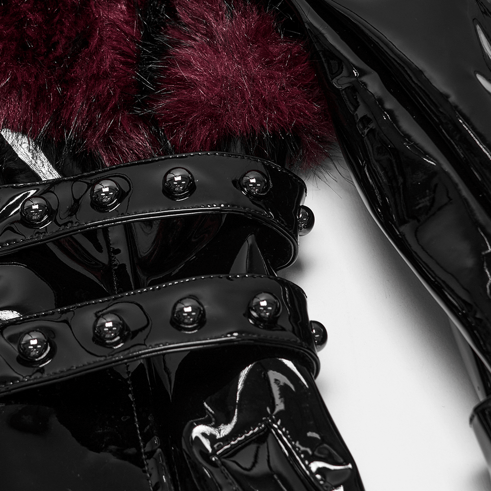 Detail of Women's Patent Leather Coat with Burgundy Faux Fur showcasing black patent finish and bondage straps.