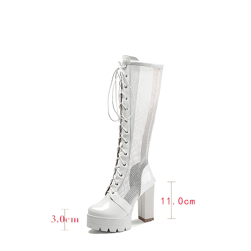 White patent leather knee-high mesh boots with high heels and laces, perfect for trendy outfits.