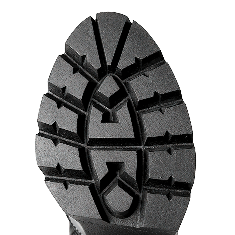 Close-up of the rugged sole of women's patent leather knee-high boots, showcasing the unique tread design for optimal grip.
