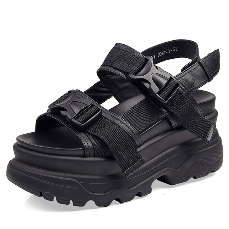 Stylish black women's platform sandals with adjustable straps and thick rubber sole for a trendy goth look.