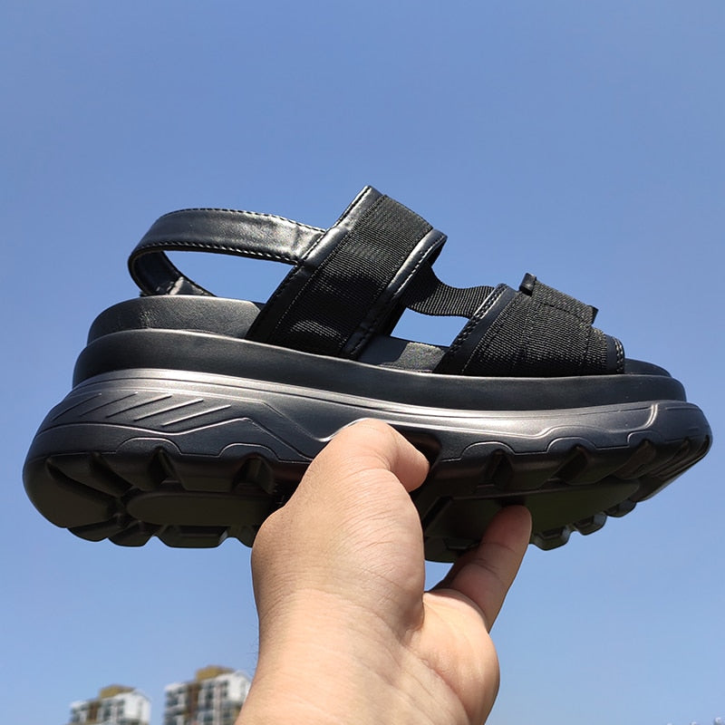 Stylish women's platform sandals with adjustable straps and thick rubber soles, perfect for a rock-inspired look.