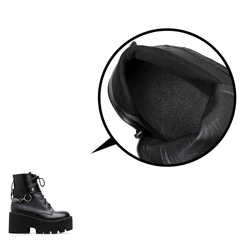 Close-up of women's black PU leather gothic boots showcasing the interior with laces and a stylish metal chain detail.