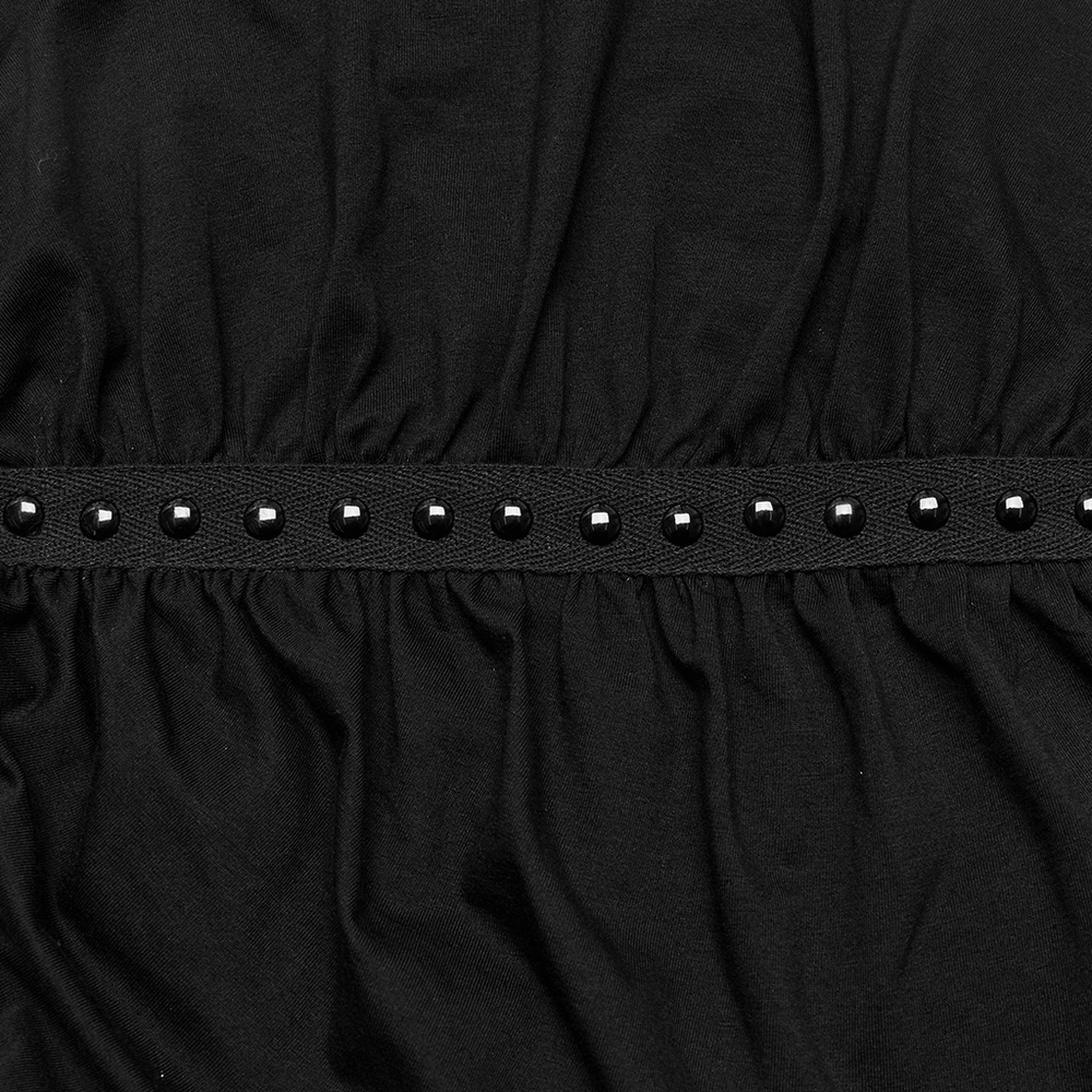 Close-up of black fabric with studded pleats, showcasing the edgy design for women's punk leggings.