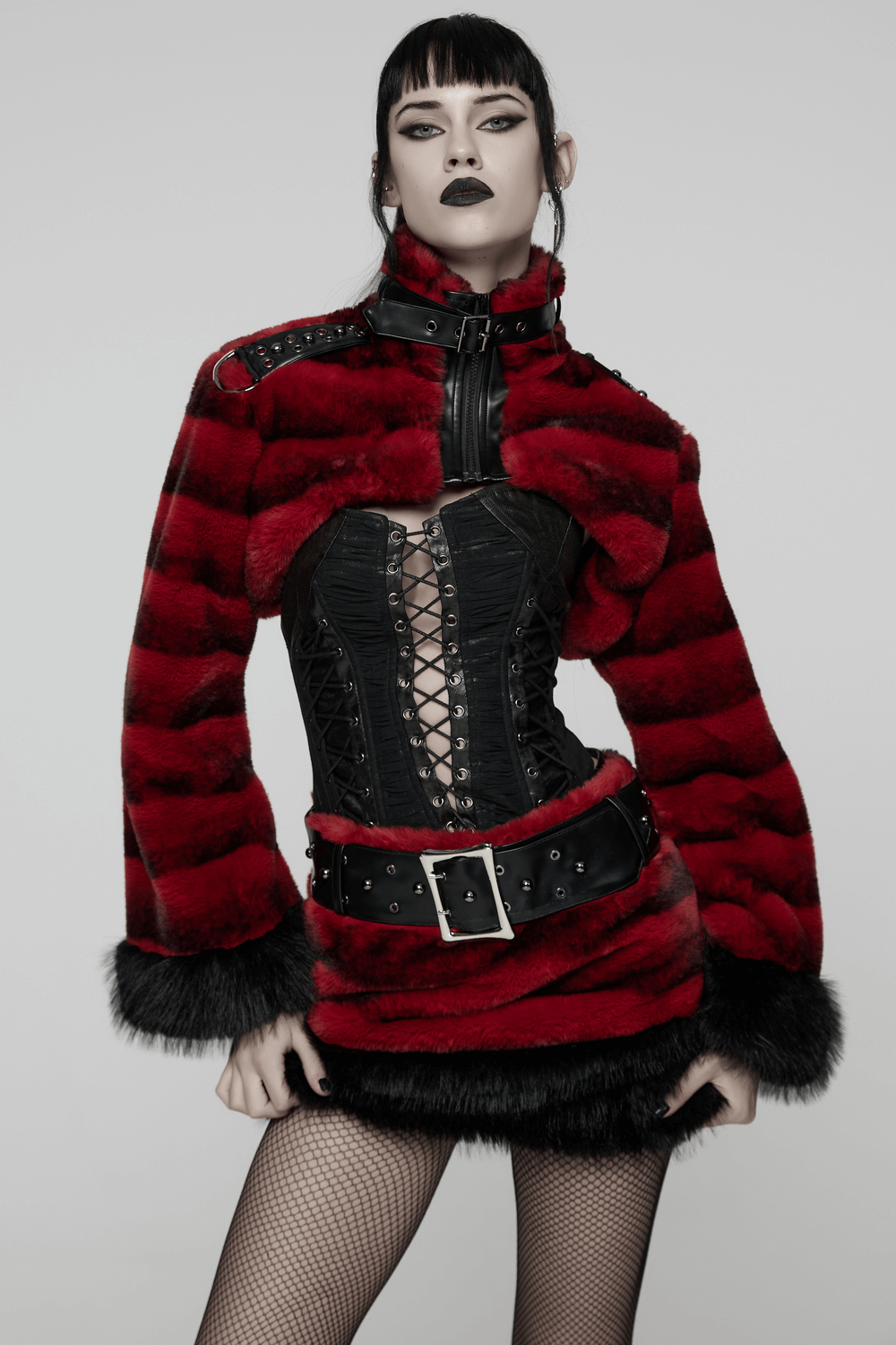 Women's Punk Faux Fur Cropped Jacket with Cuffs displayed on model in striking red and black with studded details.