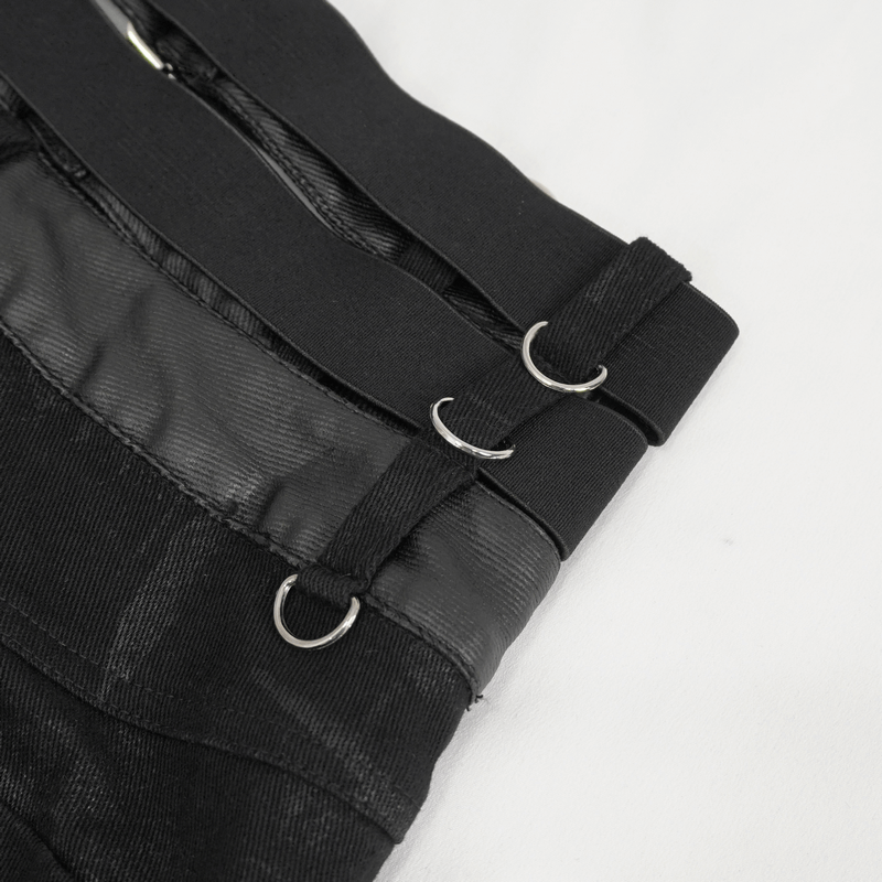 Close-up of multi-buckles on women's punk high-waisted ripped fitted pants in black, showcasing edgy style details.
