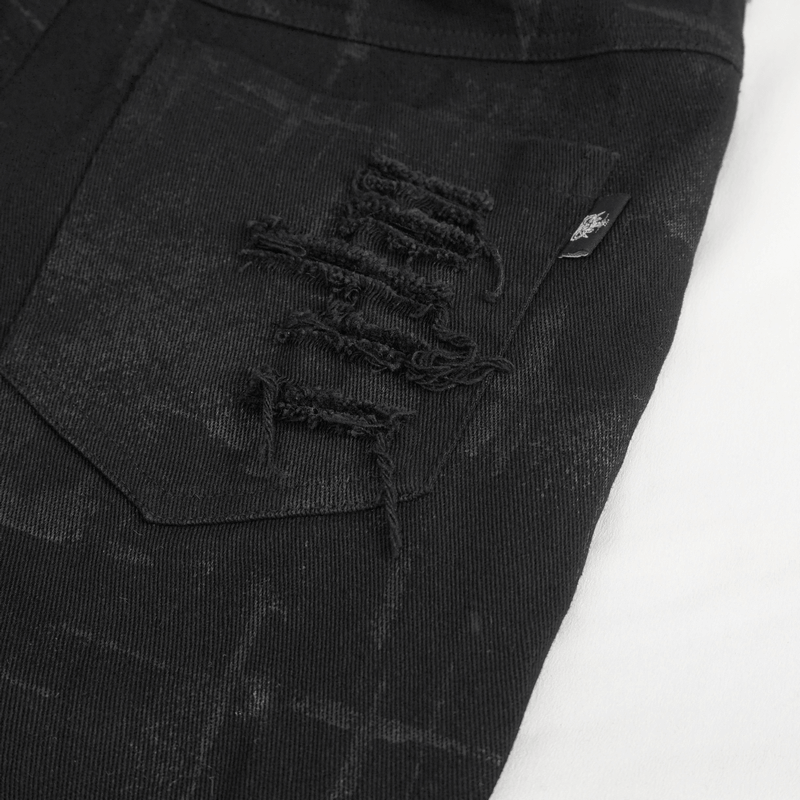 Close-up of women's punk high-waisted black ripped pants showing distressed pocket details and edgy style.