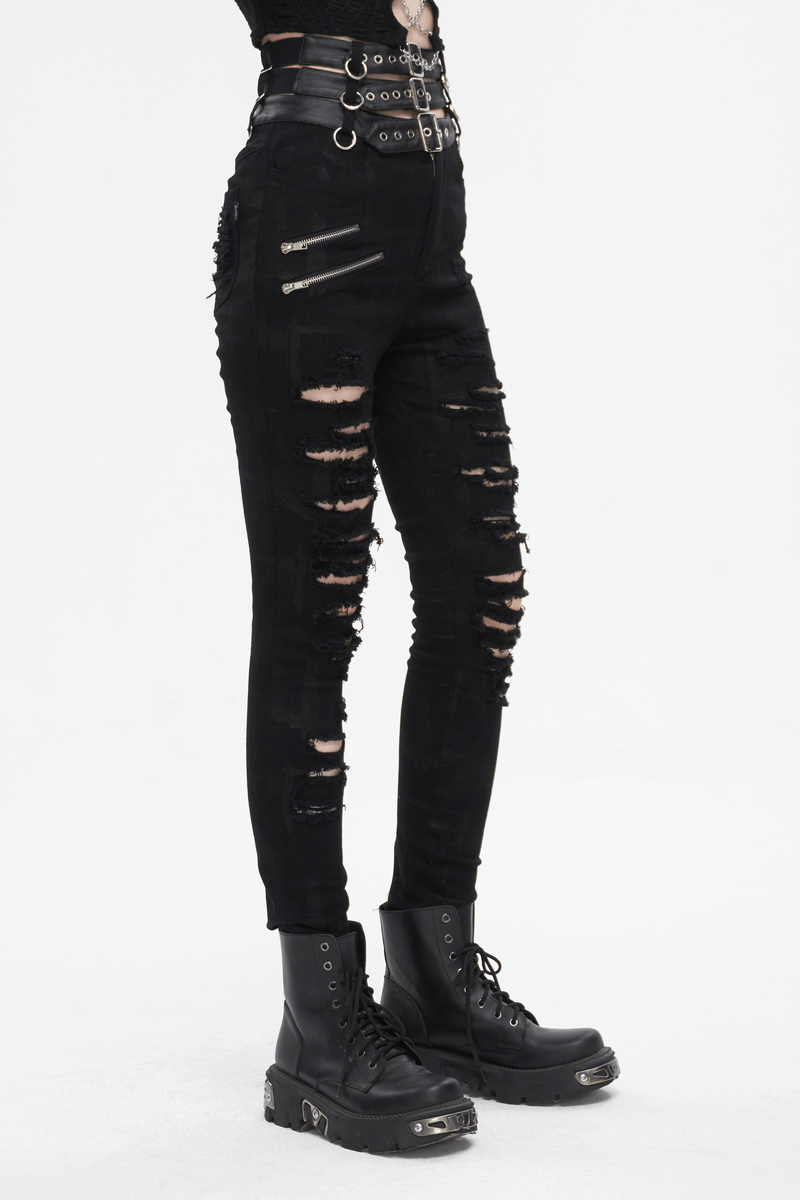 Edgy women's punk high-waisted ripped fitted pants with multi-buckles and stylish black boots.