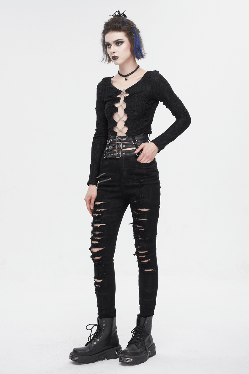 Edgy women's punk high-waisted ripped fitted pants with multi-buckles and stylish black top.