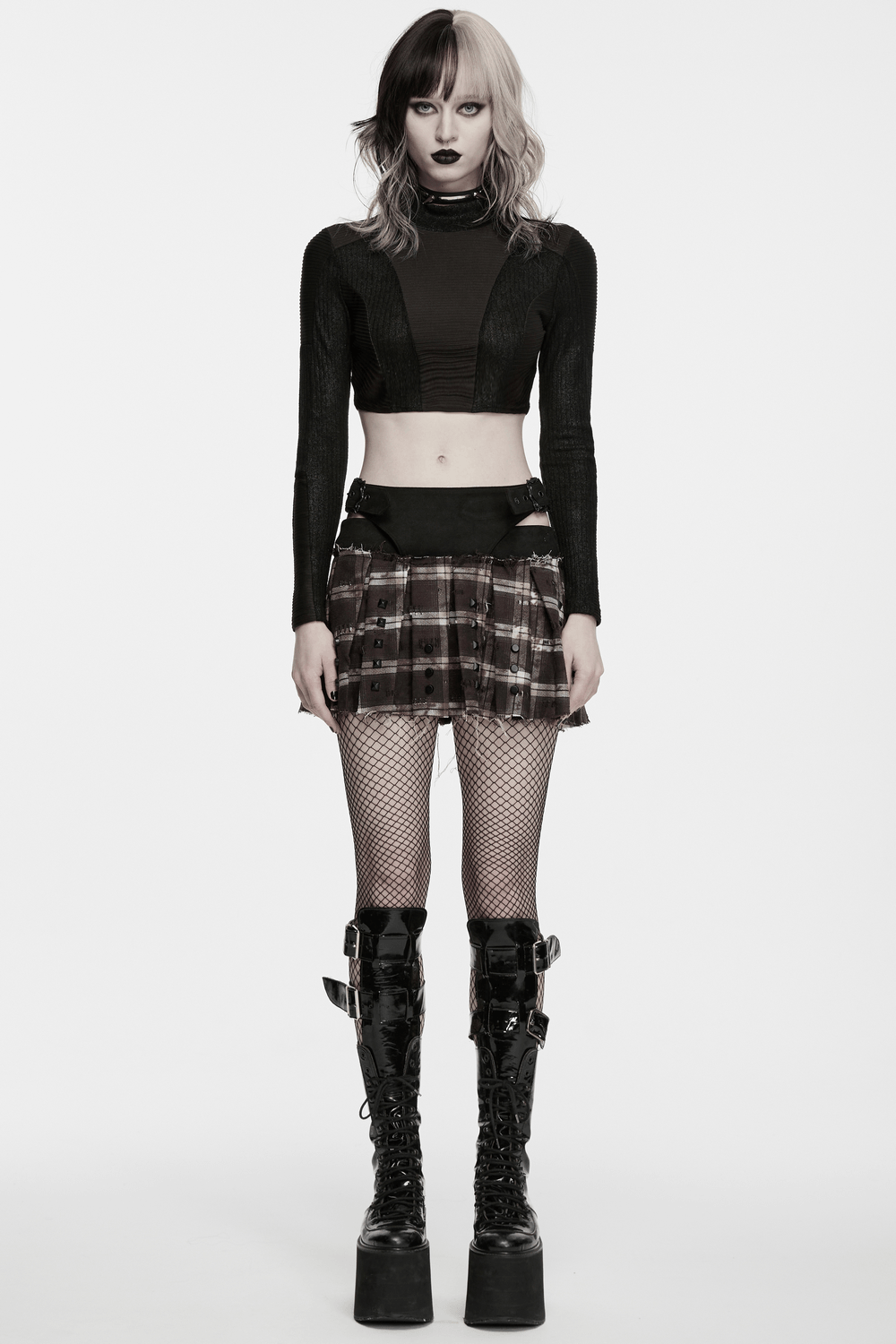 Women's Punk Plaid Mini Skirt with Studded Belt showcased on a model with edgy black and white styling.