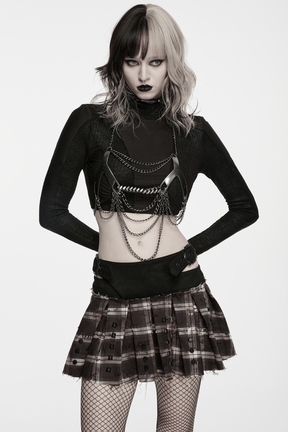 Women's Punk Plaid Mini Skirt with Studded Belt showcased by a model with edgy style and layered chains.