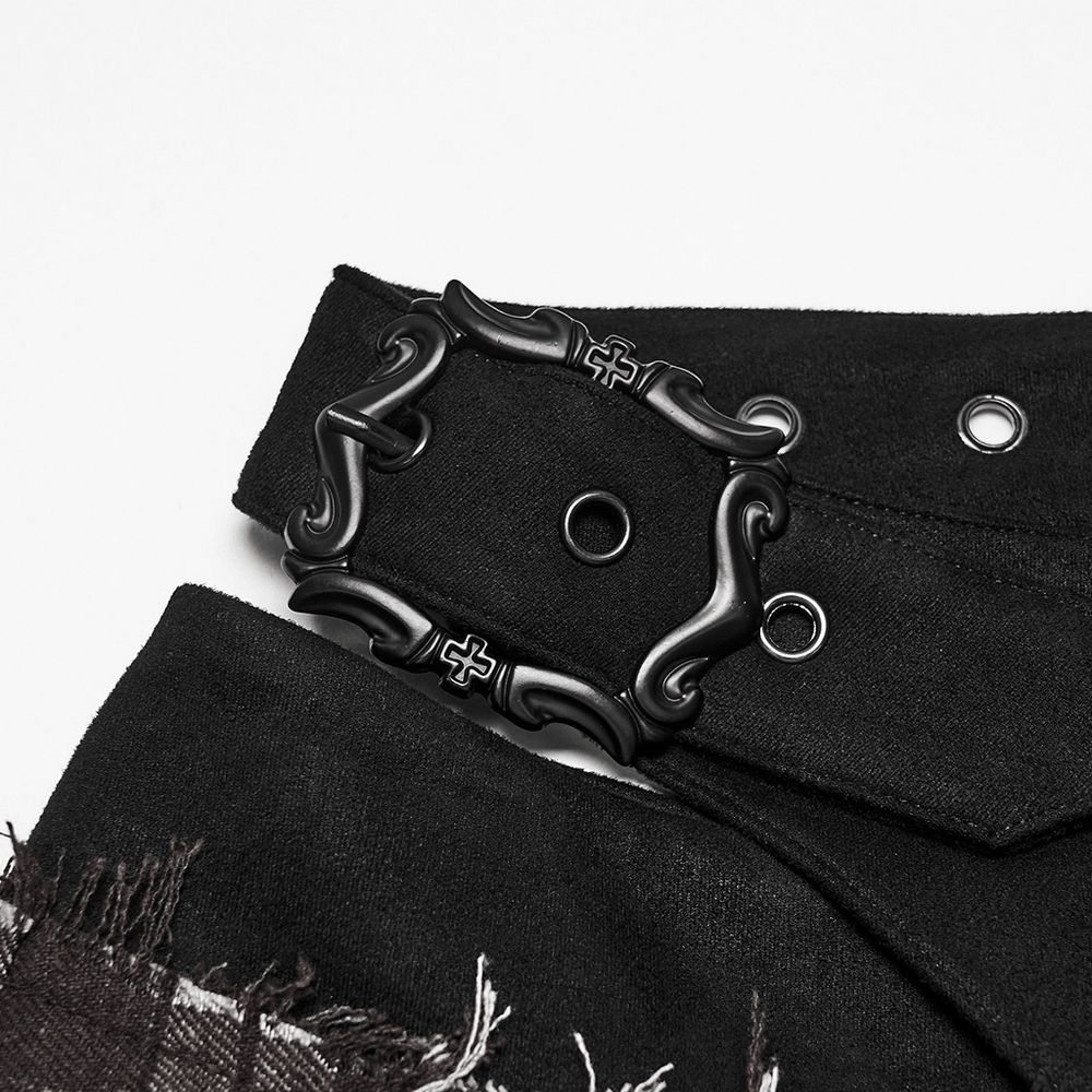 Close-up of the cross-shaped buckle on the Women's Punk Plaid Mini Skirt with Studded Belt.