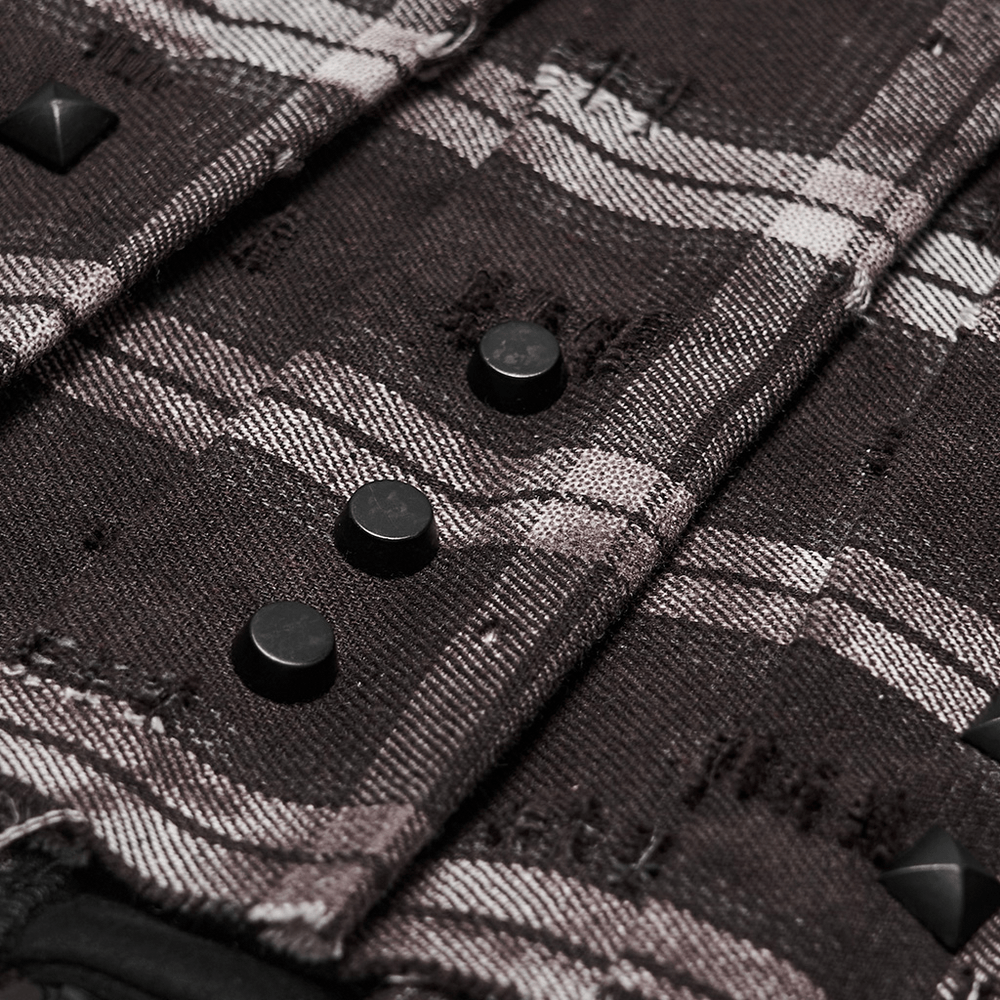 Close-up of Women's Punk Plaid Mini Skirt with Studded Belt showcasing black studs and plaid texture.