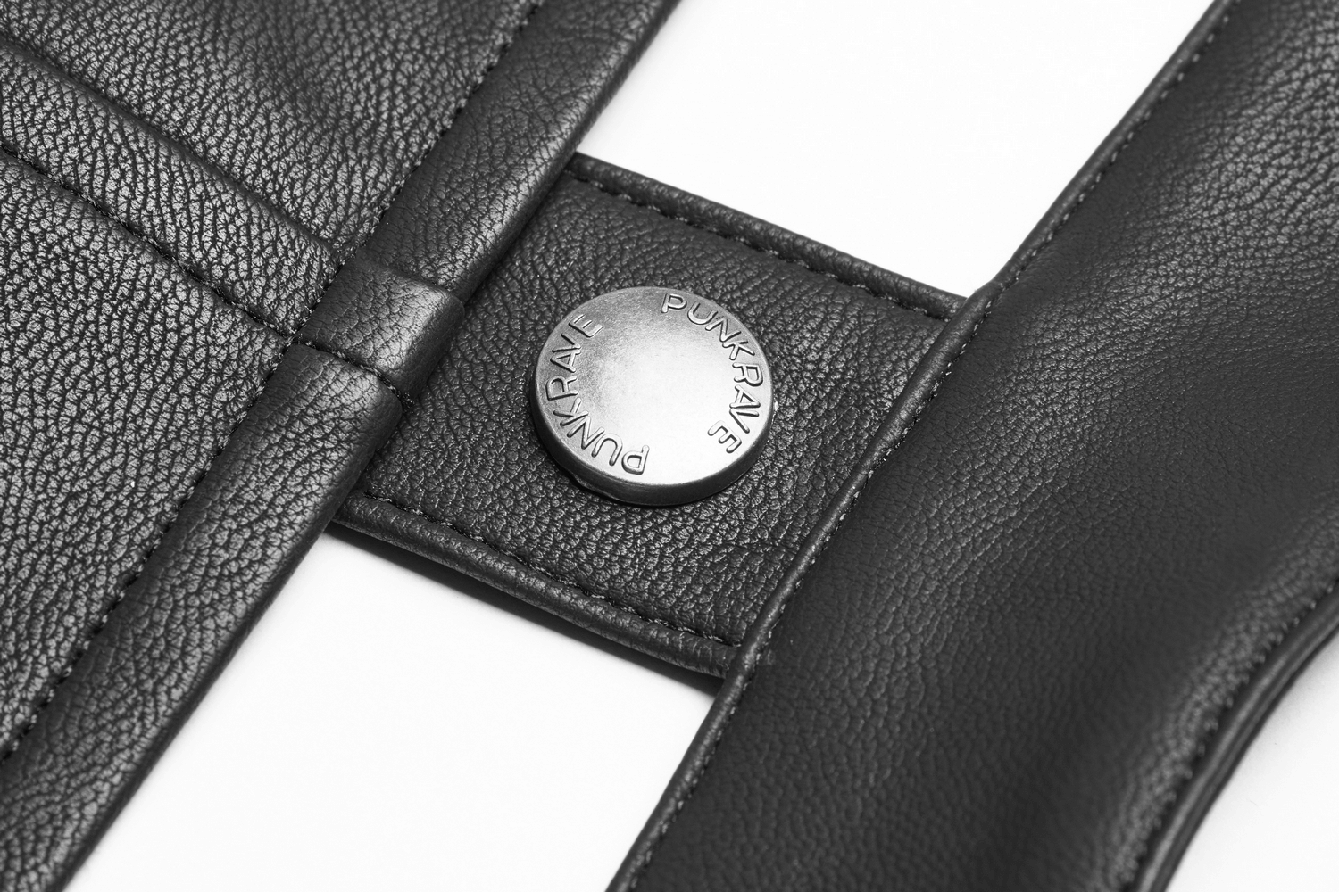 Close-up of a stylish black PU leather corset detail featuring metallic eyelet and punk rave branding.