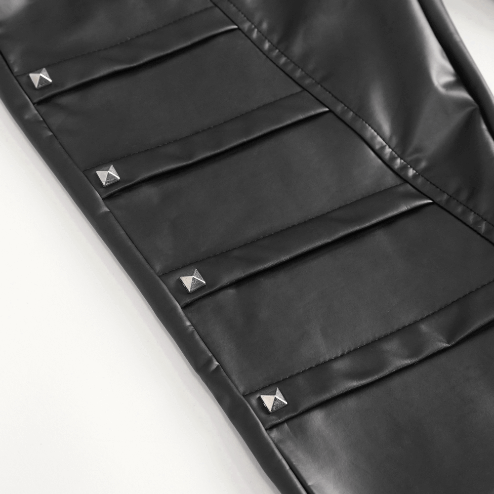 Close-up of women's punk faux leather pants with stylish chain and stud accent detailing, perfect for bold fashion statements.