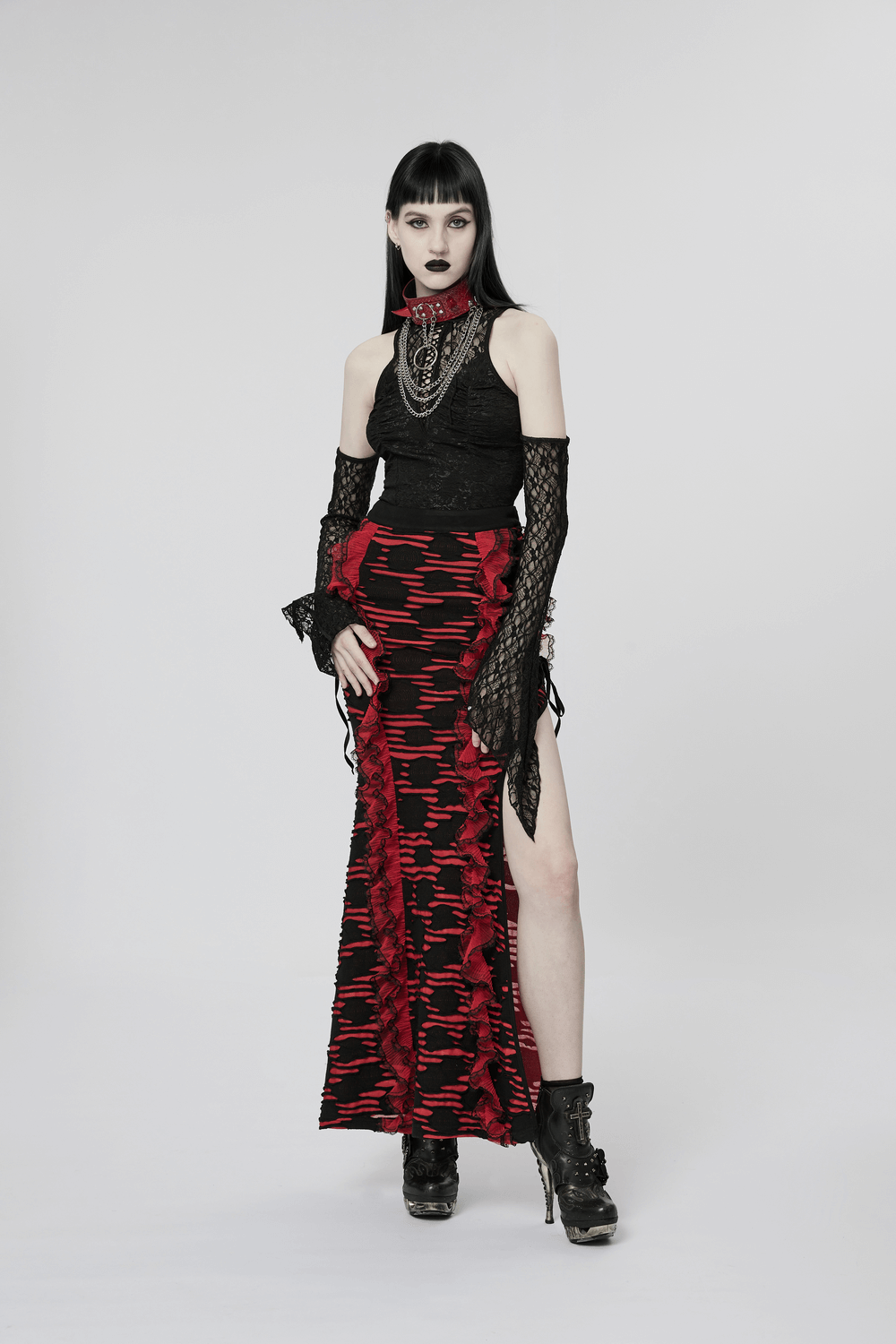 Bold gothic look featuring a model in a red and black outfit, showcasing edgy punk fashion.