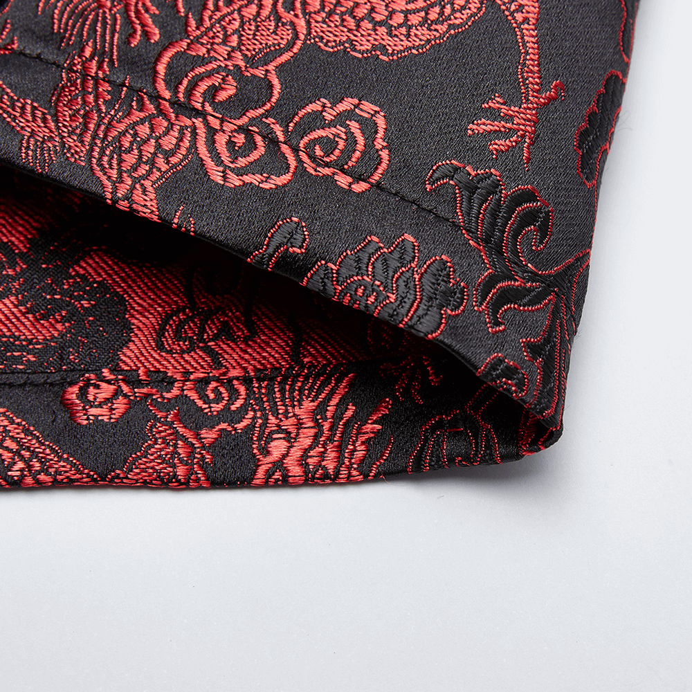 Close-up of dragon jacquard fabric, showcasing vibrant red patterns on a black background for a cybernetic dress.