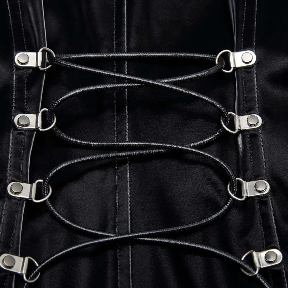 Close-up of metal buckles and lacing on a stylish black dress highlighting cyberpunk design.