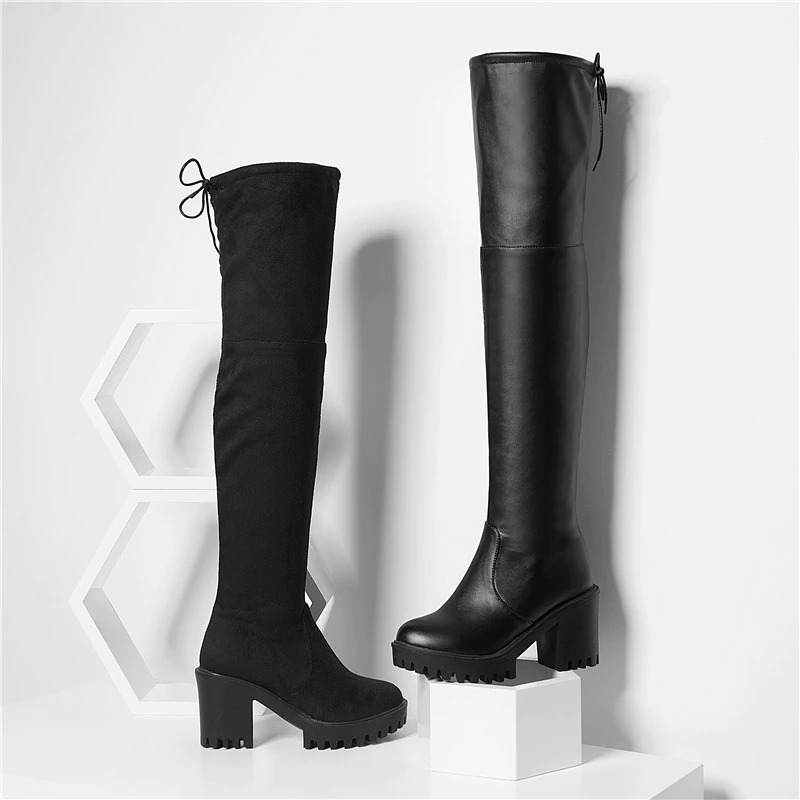 Stylish women's black thigh high platform boots, featuring sleek design and trendy medium heels.