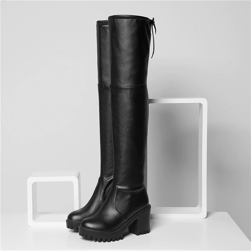 Stylish women's black round toe over the knee platform boots with medium heels, perfect for casual looks.