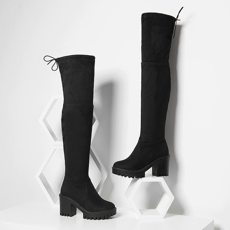 Sleek women's round toe over-the-knee black platform boots with modern design and trendy style.