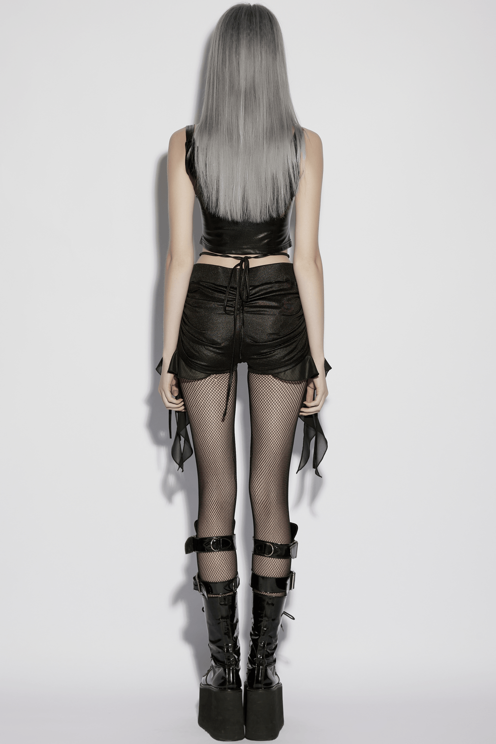 Women's Ruched Goth Shorts With Chiffon Drape Panels featuring a stylish drawstring design and edgy fishnet tights.
