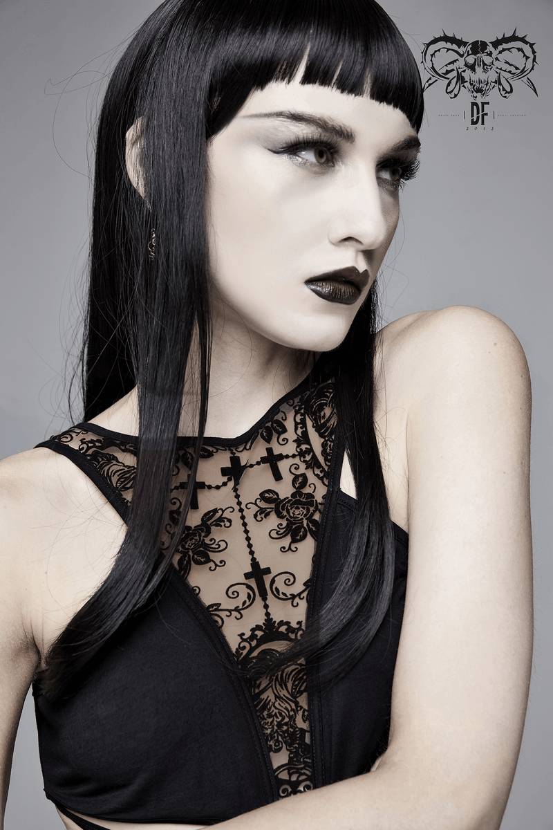 Close-up of a model with long black hair, featuring gothic-inspired attire with lace details and bold makeup.