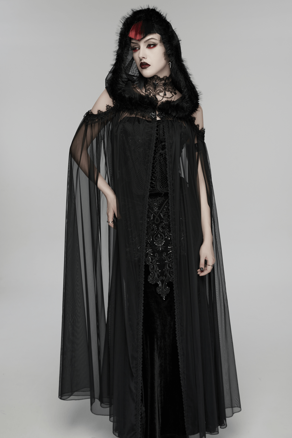 Women's Sheer Gothic Hooded Mesh Ritual Cloak on model, showcasing the ethereal design with plush fur trim and embroidered details.