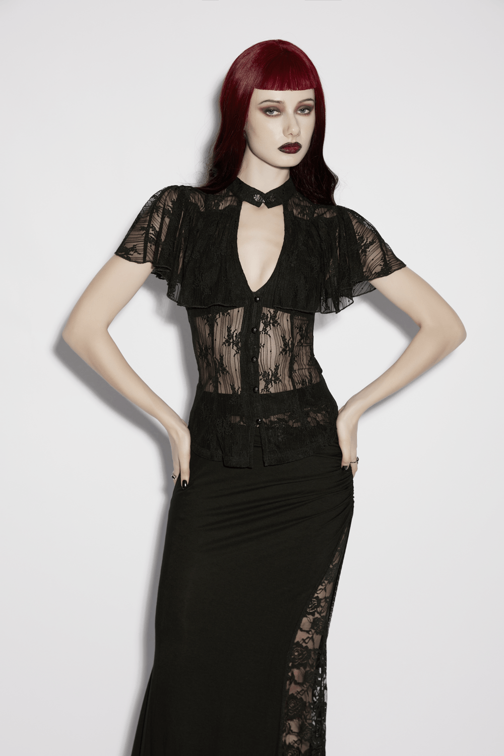 Model wearing Women's Sheer Gothic Lace Up Waist Blouse Top featuring ruffle cape sleeves and a hollow V-neckline.
