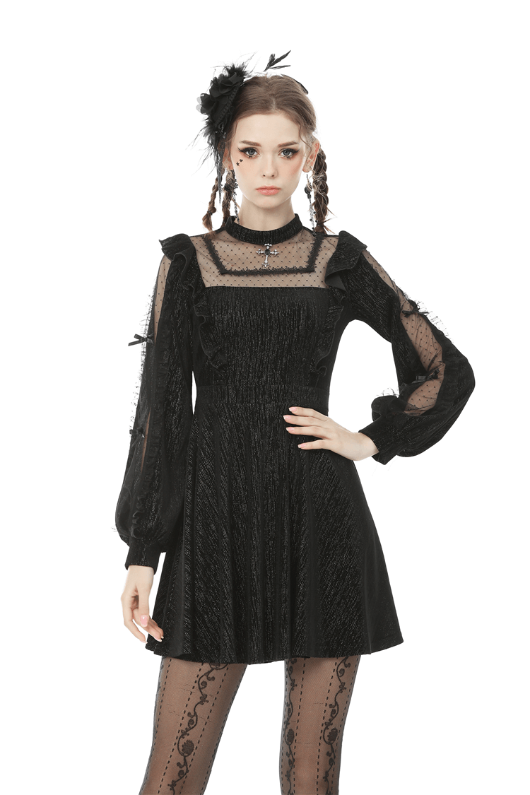 Women’s vintage black dress with sheer sleeves and square collar, exuding retro charm and elegance.