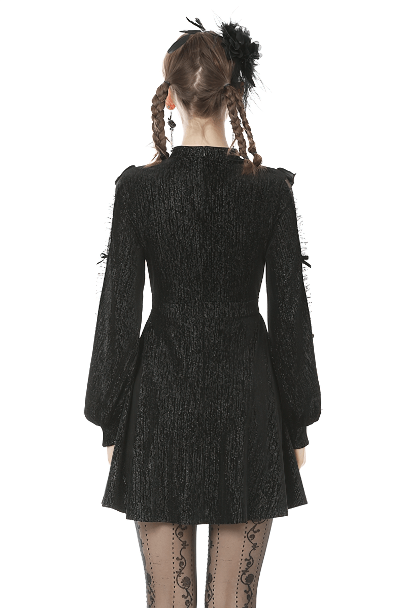 Back view of a vintage-inspired black dress with sheer sleeves and square collar, perfect for stylish women.