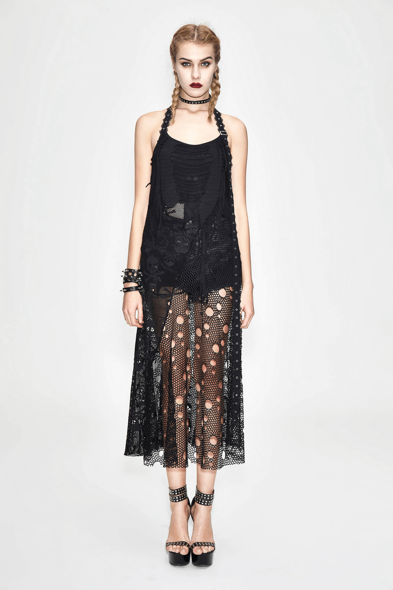 Stylish model in a black sleeveless maxi dress with mesh inserts and skull pattern, showcasing gothic fashion elegance.