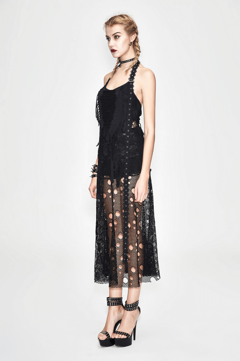 Women in a black sleeveless maxi dress with gothic skull pattern and mesh insert, styled with chic accessories.