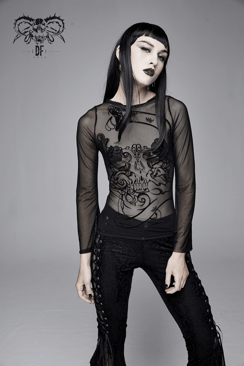 Gothic style women's black transparent top with elegant skull print and long sleeves, paired with stylish black pants.