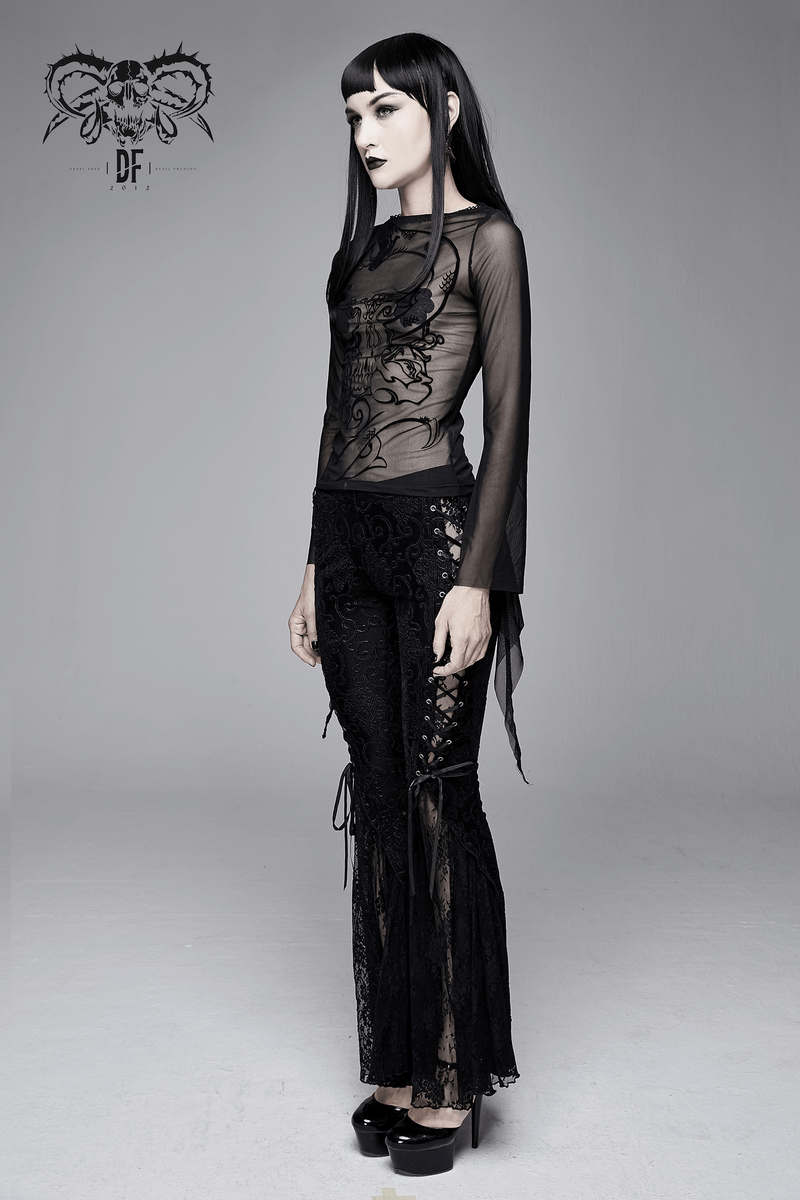 Model showcasing a women's gothic black mesh top with long sleeves and stylish print, paired with matching sheer pants.