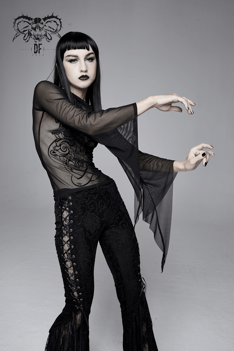 Stylish woman wearing a black transparent gothic top with long sleeves and intricate design, perfect for punk fashion.