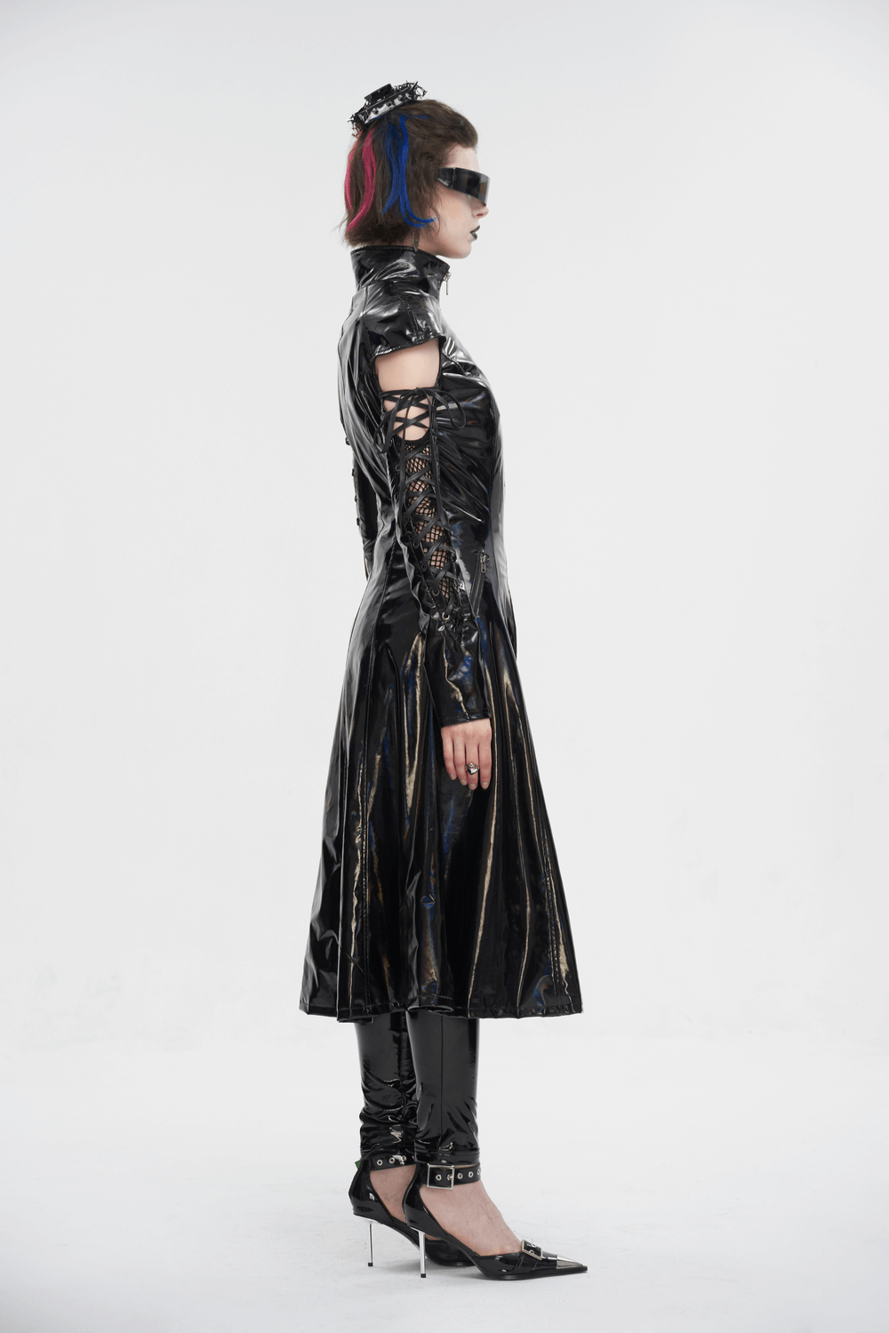 Side view of a futuristic women's stand collar patent leather coat with lace-up sleeves and edgy accessories.